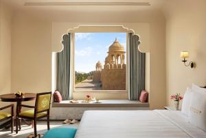 a room with a view of a building through a window at Storii By ITC Hotels, Jaisalmer in Jaisalmer