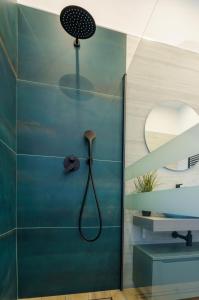a bathroom with a shower with a shower head at Lucy's Flowers in La Spezia +72 photos