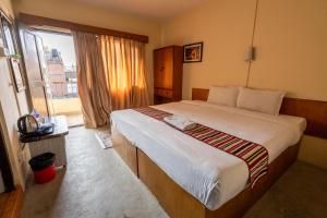 Uma cama ou camas num quarto em Hotel Nana