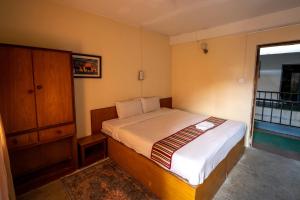 Uma cama ou camas num quarto em Hotel Nana