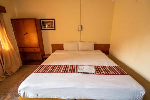 Uma cama ou camas num quarto em Hotel Nana
