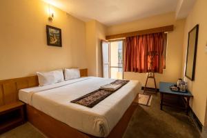 Postel nebo postele na pokoji v ubytování Hotel Nana