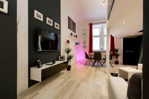 a living room with black and white walls and a table at Home, far away from Home 2 in Budapest