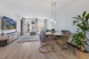 a dining room with a table and chairs at 2 Bed Apt 2 bathroom 2 freeparking by station in Dartford
