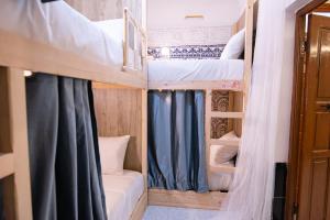 Postel nebo postele na pokoji v ubytování Smile Hostel