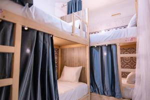 Postel nebo postele na pokoji v ubytování Smile Hostel