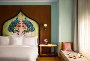 a hotel room with a bed and a table at Storii By ITC Hotels, Jaisalmer in Jaisalmer