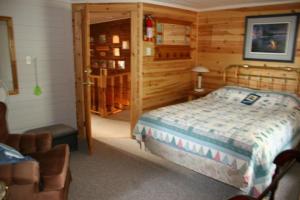 Ένα ή περισσότερα κρεβάτια σε δωμάτιο στο Sunny Rock Bed & Breakfast