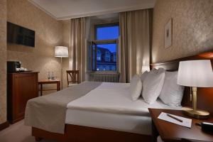Postel nebo postele na pokoji v ubytování Hotel Rott