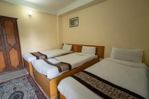 Uma cama ou camas num quarto em Hotel Nana