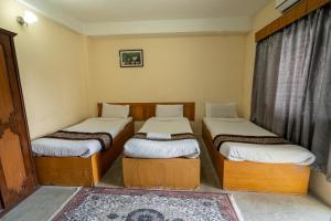 Uma cama ou camas num quarto em Hotel Nana