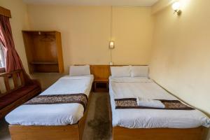 Uma cama ou camas num quarto em Hotel Nana