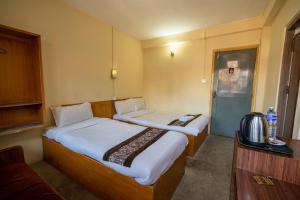 Uma cama ou camas num quarto em Hotel Nana
