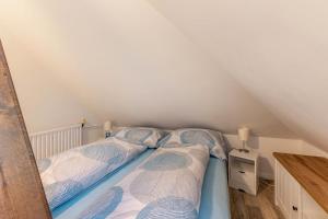 Postel nebo postele na pokoji v ubytování Ferienwohnung Backbord Deichhausen