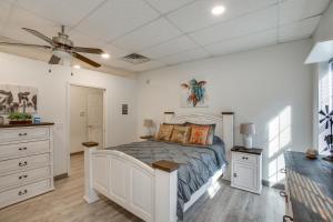 a bedroom with a bed and a ceiling fan at 8 Mi to Kentucky Downs Quiet Getaway with Patio in Portland
