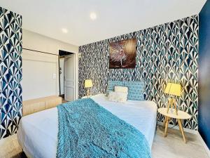 Posteľ alebo postele v izbe v ubytovaní Suite Isaac - Appartement d'exception