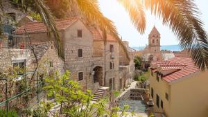 a view of a city with a church and buildings at Apartments Karla in Stanići
