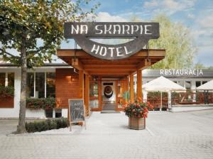 a hotel with a sign that reads nr sharpe hotel at Hotel Na Skarpie - Charzykowy in Charzykowy