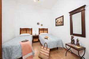 Łóżko lub łóżka w pokoju w obiekcie Villa Sol Y Mar