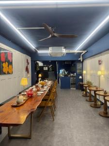 a dining room with wooden tables and chairs at Dada House in Seoul