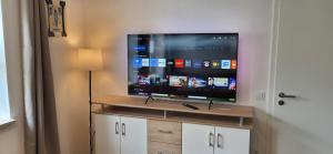 a flat screen tv sitting on top of a cabinet at Ferienwohnung Schwarzach in Schwarzach