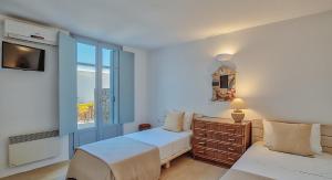 Postel nebo postele na pokoji v ubytování Villa Afroditi B