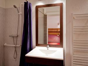 a bathroom with a sink and a mirror at Studio rénové 4 pers avec balcon et lave-linge - FR-1-512-147 in Brides-les-Bains