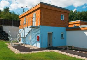 a building with a staircase on the side of it at Aparthotel DKS in Chomutov