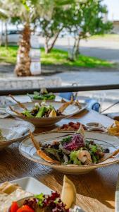a bunch of plates of food on a table at The Kumsal Hotel Oludeniz in Oludeniz