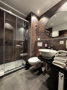 Koupelna v ubytování Hotel Luisenpark + 24 fotografií