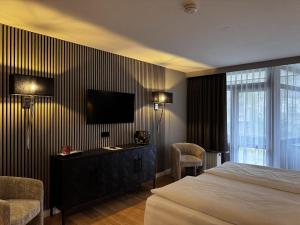 Postel nebo postele na pokoji v ubytování Hotel Luisenpark