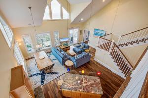 an overhead view of a living room with a blue couch at The Lighthouse Keeper in Folly Beach