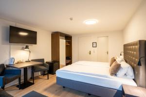 Postel nebo postele na pokoji v ubytování Hotel Baslertor