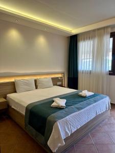Llit o llits en una habitació de The Kumsal Hotel Oludeniz