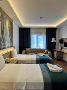 Llit o llits en una habitació de The Kumsal Hotel Oludeniz