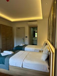 Llit o llits en una habitació de The Kumsal Hotel Oludeniz