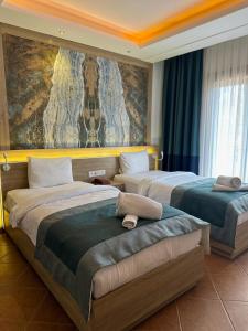 Llit o llits en una habitació de The Kumsal Hotel Oludeniz