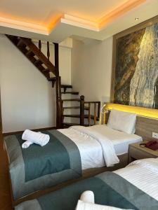 Llit o llits en una habitació de The Kumsal Hotel Oludeniz
