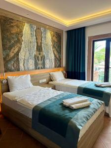 Llit o llits en una habitació de The Kumsal Hotel Oludeniz