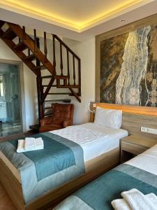 Llit o llits en una habitació de The Kumsal Hotel Oludeniz