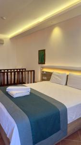 Llit o llits en una habitació de The Kumsal Hotel Oludeniz