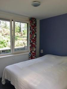 Postel nebo postele na pokoji v ubytování Villa dichtbij het strand