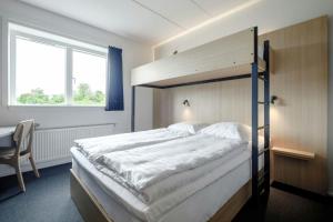Rúm í herbergi á Four Points Flex by Sheraton Ballerup