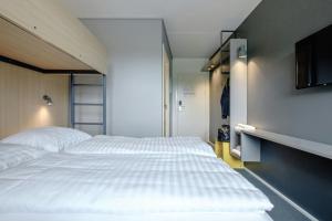 Rúm í herbergi á Four Points Flex by Sheraton Ballerup