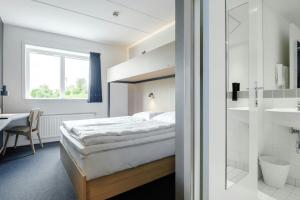 Rúm í herbergi á Four Points Flex by Sheraton Ballerup