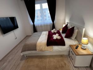 Postel nebo postele na pokoji v ubytování Glamour Residence