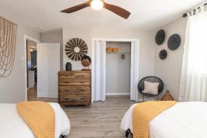 a bedroom with a bed and a ceiling fan at Family friendly & 5-mins to downtown Graham in Graham