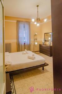 a hotel room with a bed and a mirror at La Magnolia del Ducato in Parma