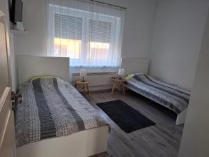 Postel nebo postele na pokoji v ubytování Werner Apartman
