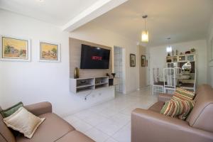 Una televisión o centro de entretenimiento en BK64 - Próx Calçadão, 2 Dorm Climatizados